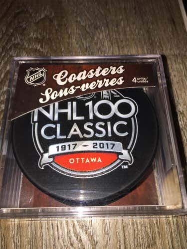 New HOCKEY PUCK SET OF 4 COASTERS NHL 100 CLASSIC 1917-2017