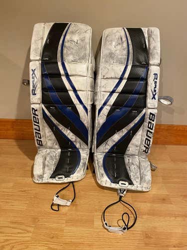 White Used Senior 33" Bauer RX8 Goalie Leg Pads.  Adjustable knee locks, calf wraps, thigh guards.