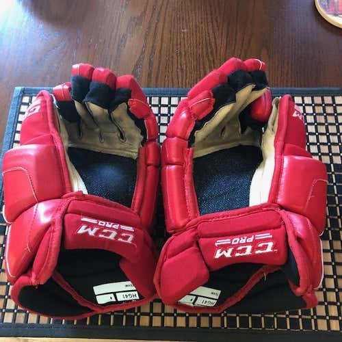 Red Used Senior CCM Gloves 14" Pro Stock
