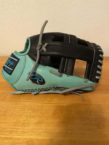 Black/Mint Used Adult Rawlings Right Hand Throw Infield Heart of the Hide Baseball Glove 11.75"
