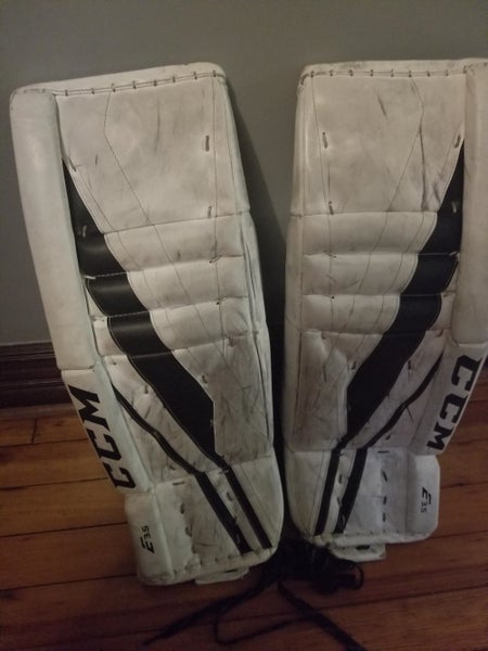White Used Junior 28" CCM Extreme Flex E3.5 Goalie Leg Pads