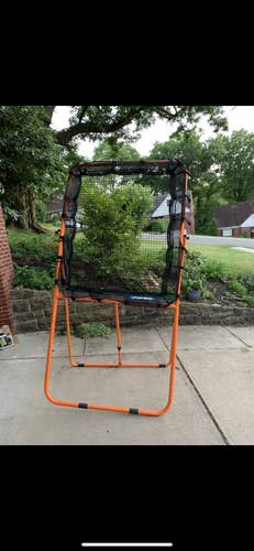 Primed lacrosse rebounder