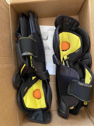 Two right CCM 9080 shin pads 15 and 16