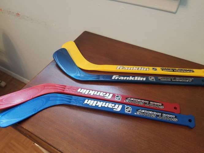 Used knee hockey sticks