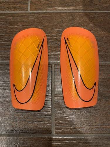 Youth NIKE shin guards bright Orange and Yellow