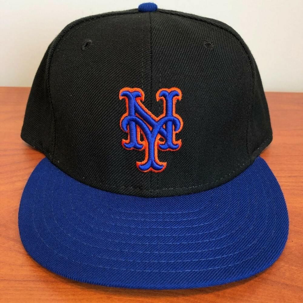 black mets hat with blue brim