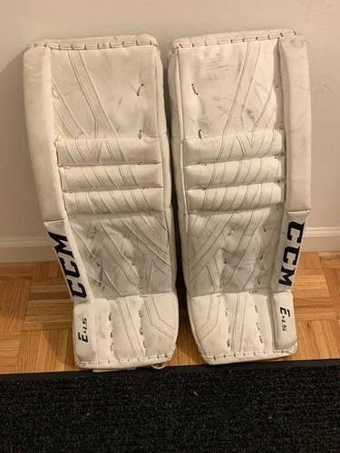 White Used Junior 28" CCM Extreme Flex E4.5 Goalie Leg Pads