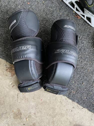 Black Senior Bauer Pro Stock Supreme Knee Guards