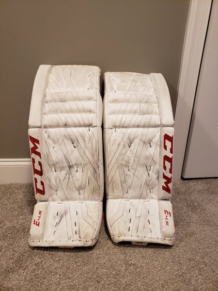 White Used Junior 28" CCM Extreme Flex E4.5 Goalie Leg Pads