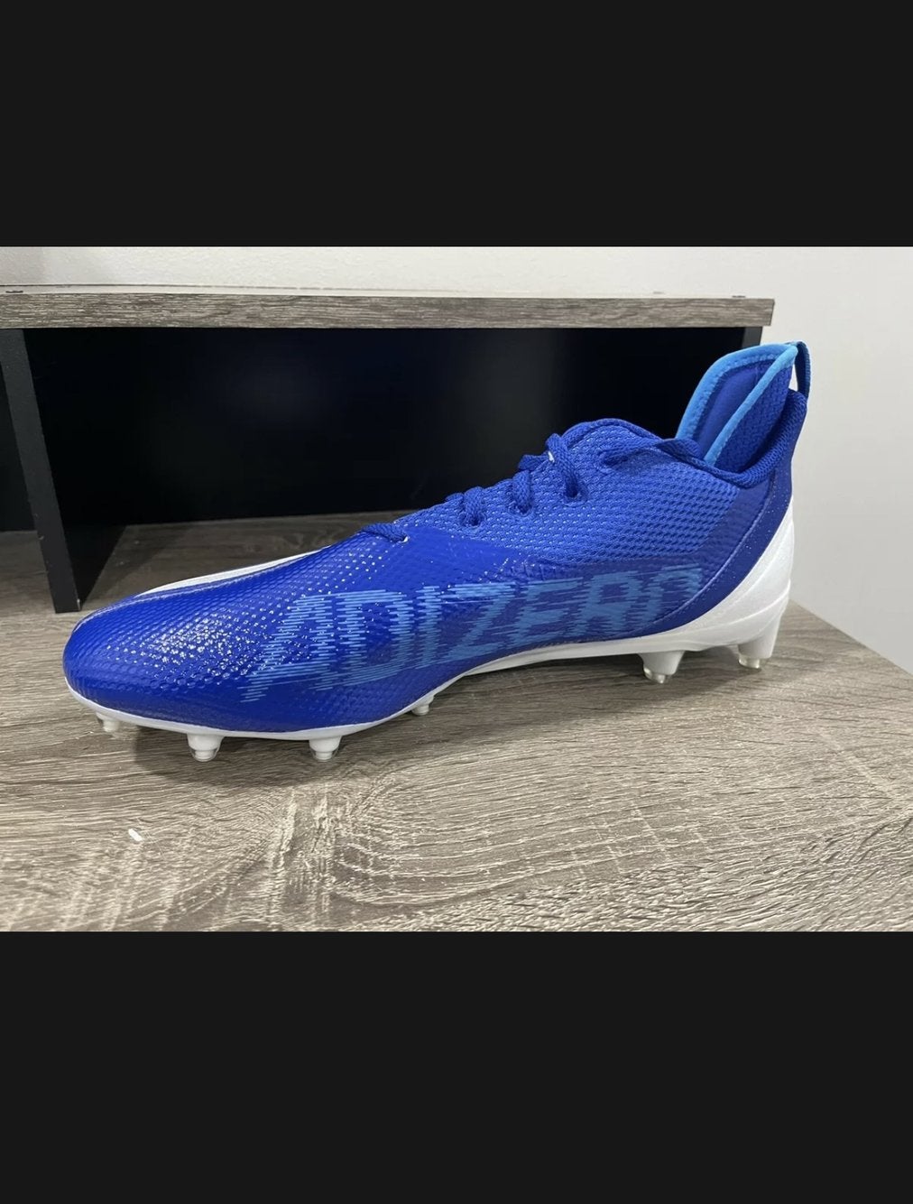 light blue adidas football cleats