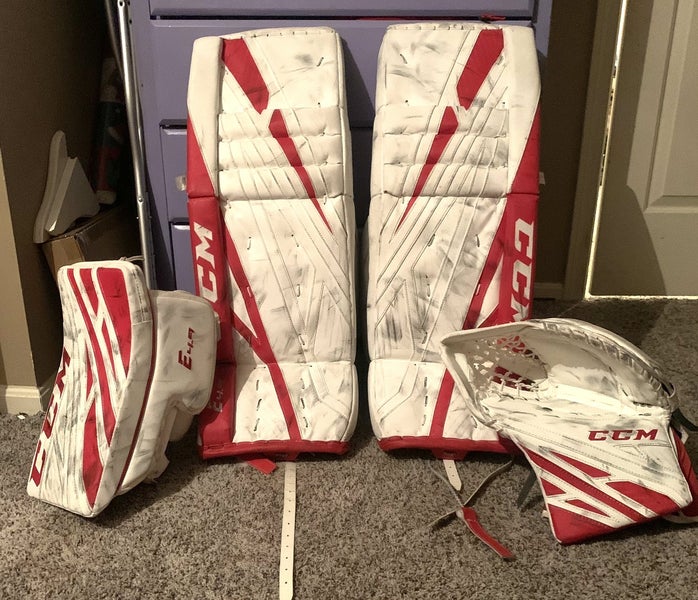 Red Intermediate 32" CCM Extreme flex 4.9 leg pads, glove, blocker