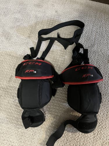 Junior CCM knee pads with garter belt