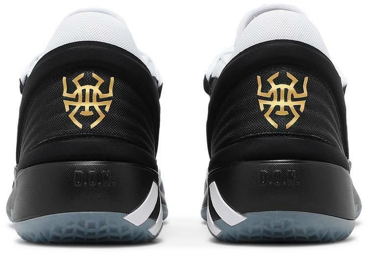 gold and white basketball shoes