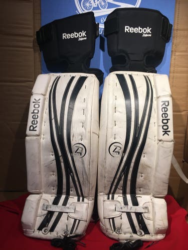 Used 24+1" Reebok Premier 4 14K jr leg pads