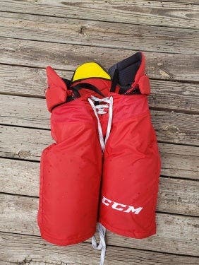 Red Senior Used Medium +1 CCM HPTK Hockey Pants Pro Stock Carolina Hurricanes