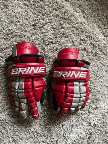 Used pair of Brine Triumph lacrosse gloves