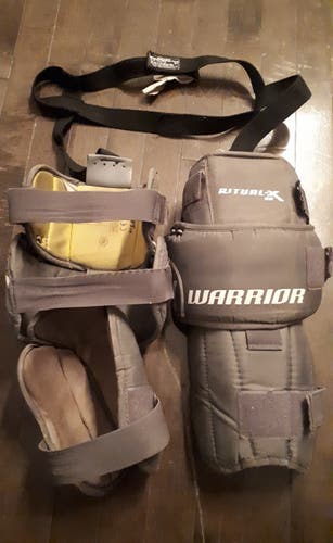 Used Warrior Ritual X Senior goalie knee pads with Bauer garter belt