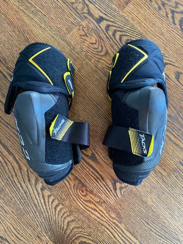 Bauer shin pads and CCM elbow pads, Sold As Bundle