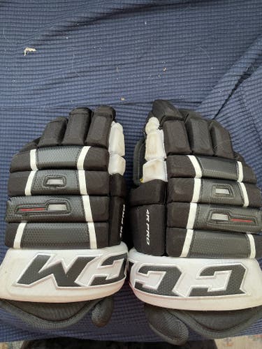 Used CCM Tacks 4 Roll Pro Gloves 15"