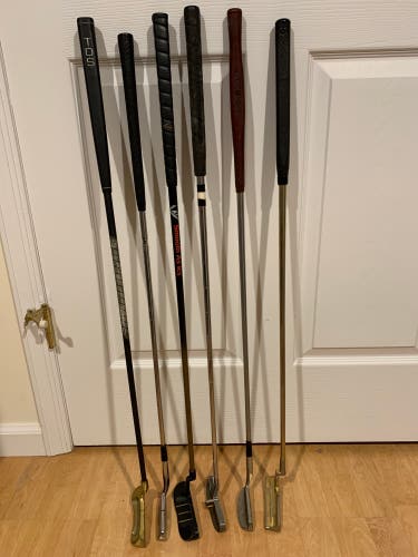 Six golf putters