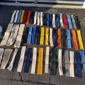 50 Mesh pieces, Stringing kits, chin straps, and more