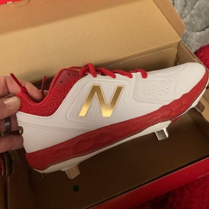New balance softball/fast pitch Womans metal cleats new with box