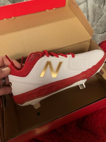 New balance softball/fast pitch Womans metal cleats new with box