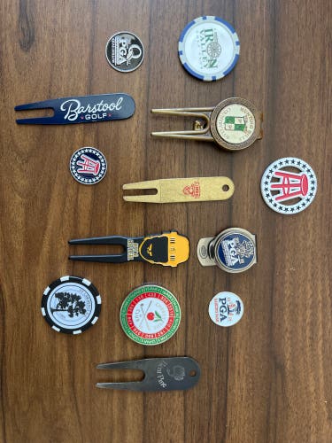 Assorted golf ball markers and divot repair tools