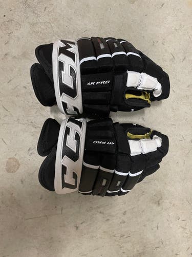 Used CCM Tacks 4 Roll Pro Gloves 14"