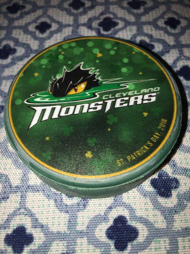 GREEN 2018 ST PATRICK’S DAY CLEVELAND MONSTERS A.H.L . HOCKEY PUCK -
