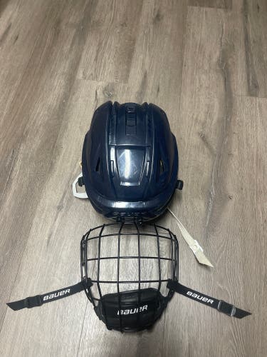Lightly Used Navy Large Bauer Re-Akt 150 With Brand New Medium Black Bauer Cage