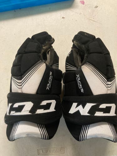 Used black CCM Tacks 3092 Gloves 13"