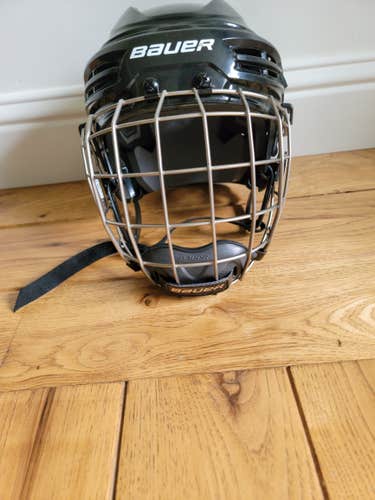 Used Large Bauer IMS 5.0 Helmet with a BAUER RE-AKT TITANIUM FACEMASK