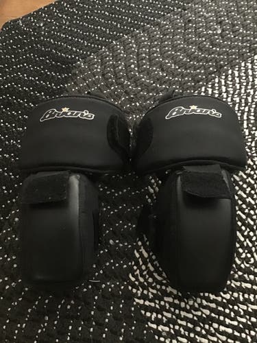 Used Brian's senior goalie knee guards