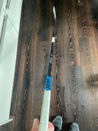 Harvard hockey player stick