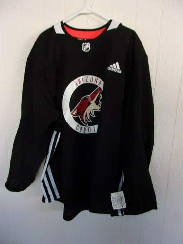 Arizona Coyotes unused black Adidas practice jersey (size 58) with manufacturer's tag on sleeve