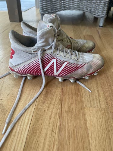 Red and White New Balance Freeze Cleats