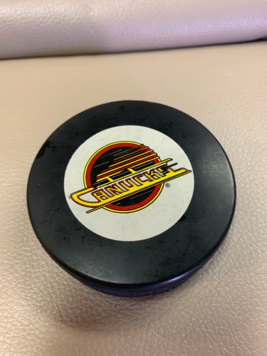 Vintage Vancouver Canucks trench mfg. puck