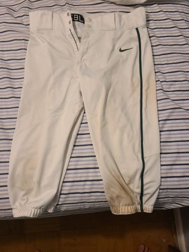 White nike short pants with green piping