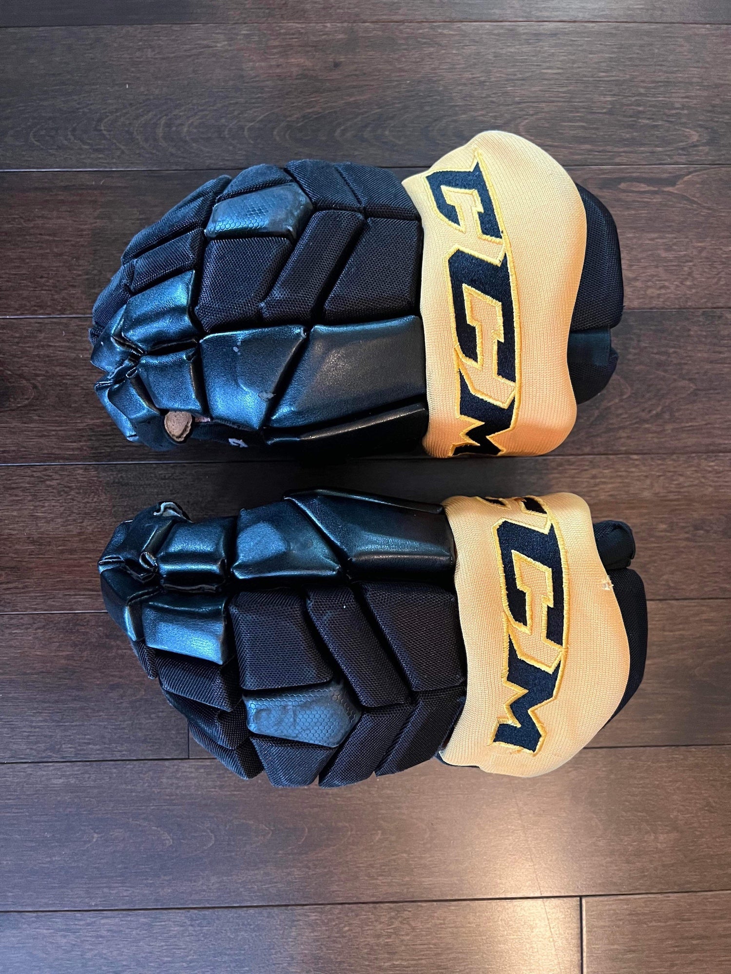 Pro stock CCM HG97 hockey gloves 13" Alaska Nanooks Royal Blue Yellow 4roll SR 