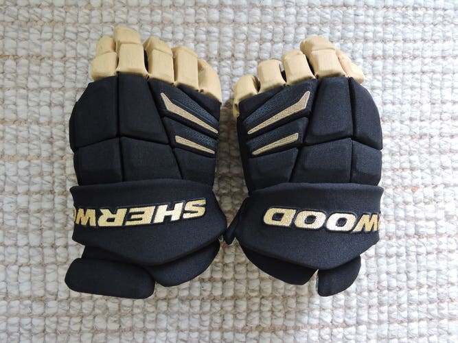 Lightly Used Sher-Wood Rekker Black and Gold Gloves 14" Pro Stock