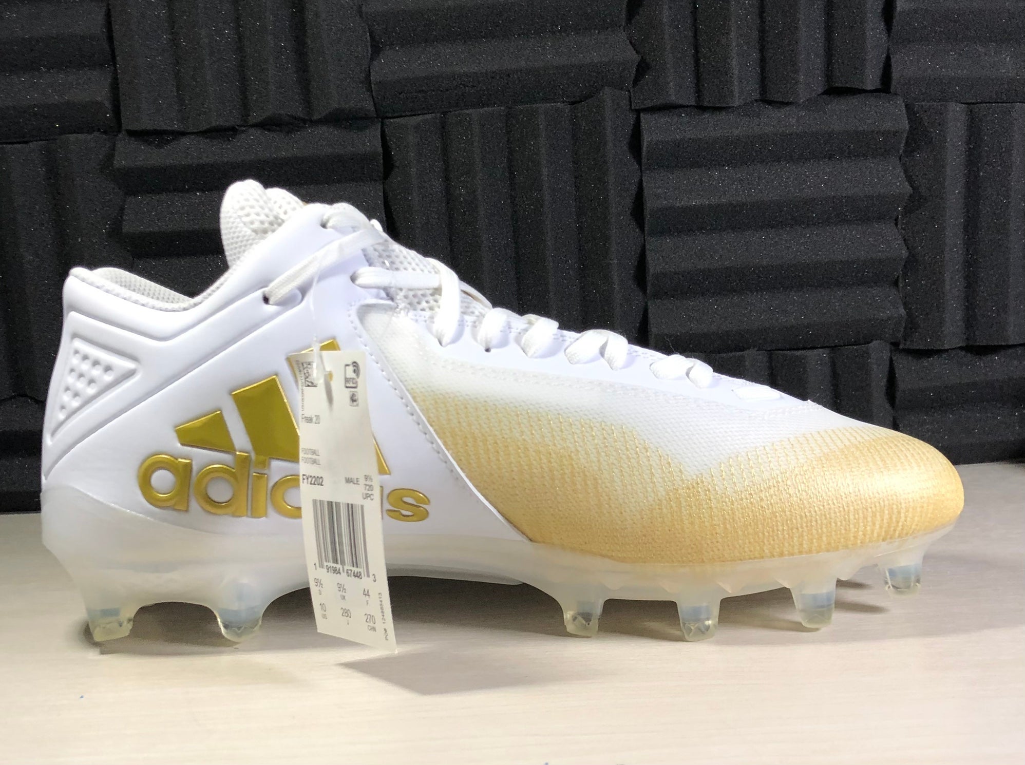 white and yellow football cleats
