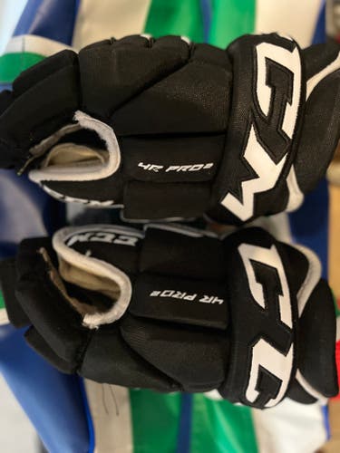 Used CCM Tacks 4 Roll Pro II Gloves 13"