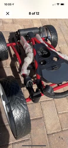 Golf caddy cart new.  Comes with 4 removable wheels RED