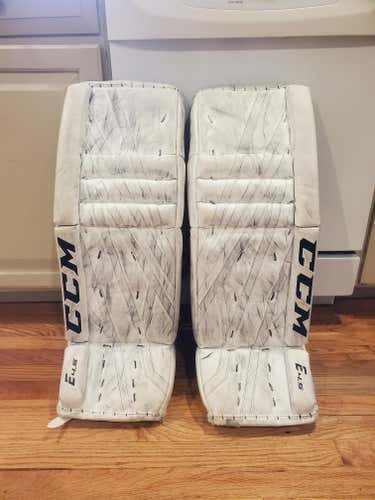 White Used Junior 28" CCM Extreme Flex E4.5 Goalie Leg Pads