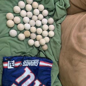38 USED LACROSSE BALLS , will SHIP WITH NY GIANTS STRING BAG