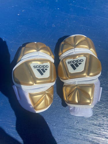Gold Adidas elbow pads