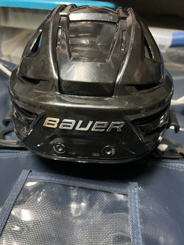 Small black Bauer ReAkt 150 helmet