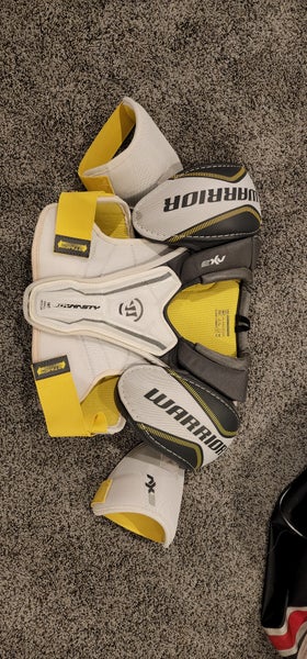 New Intermediate Small/Medium Warrior Dynasty AX3 Shoulder Pads and 1 pr of Used Gloves 12"