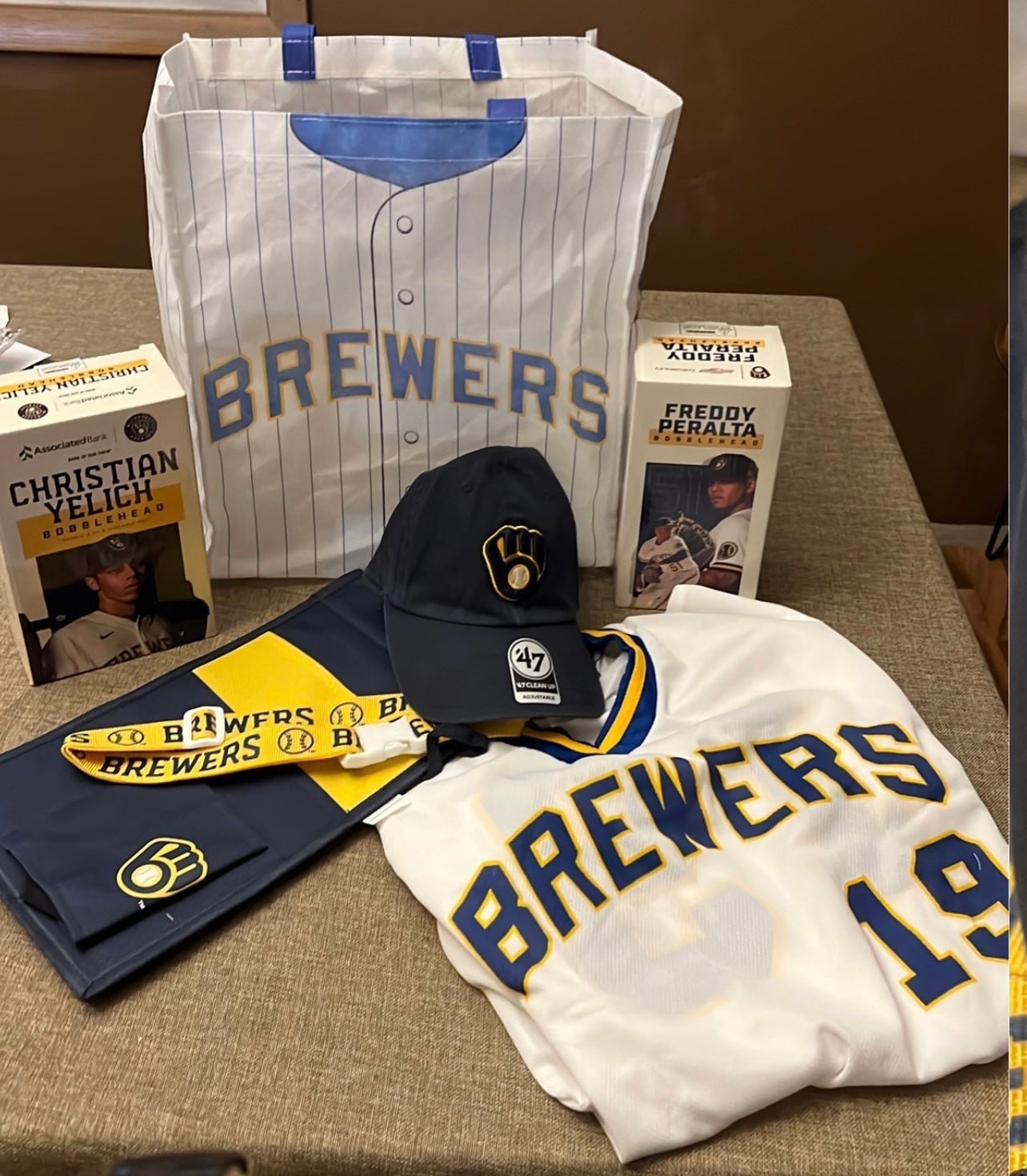 Christian Yelich + Freddy Peralta bobble head Milwaukee Brewers bag jersey  hat